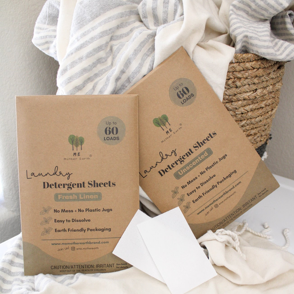 Fresh linen and unscented laundry sheets in brown paper packaging with one sheet ripped in half. 
