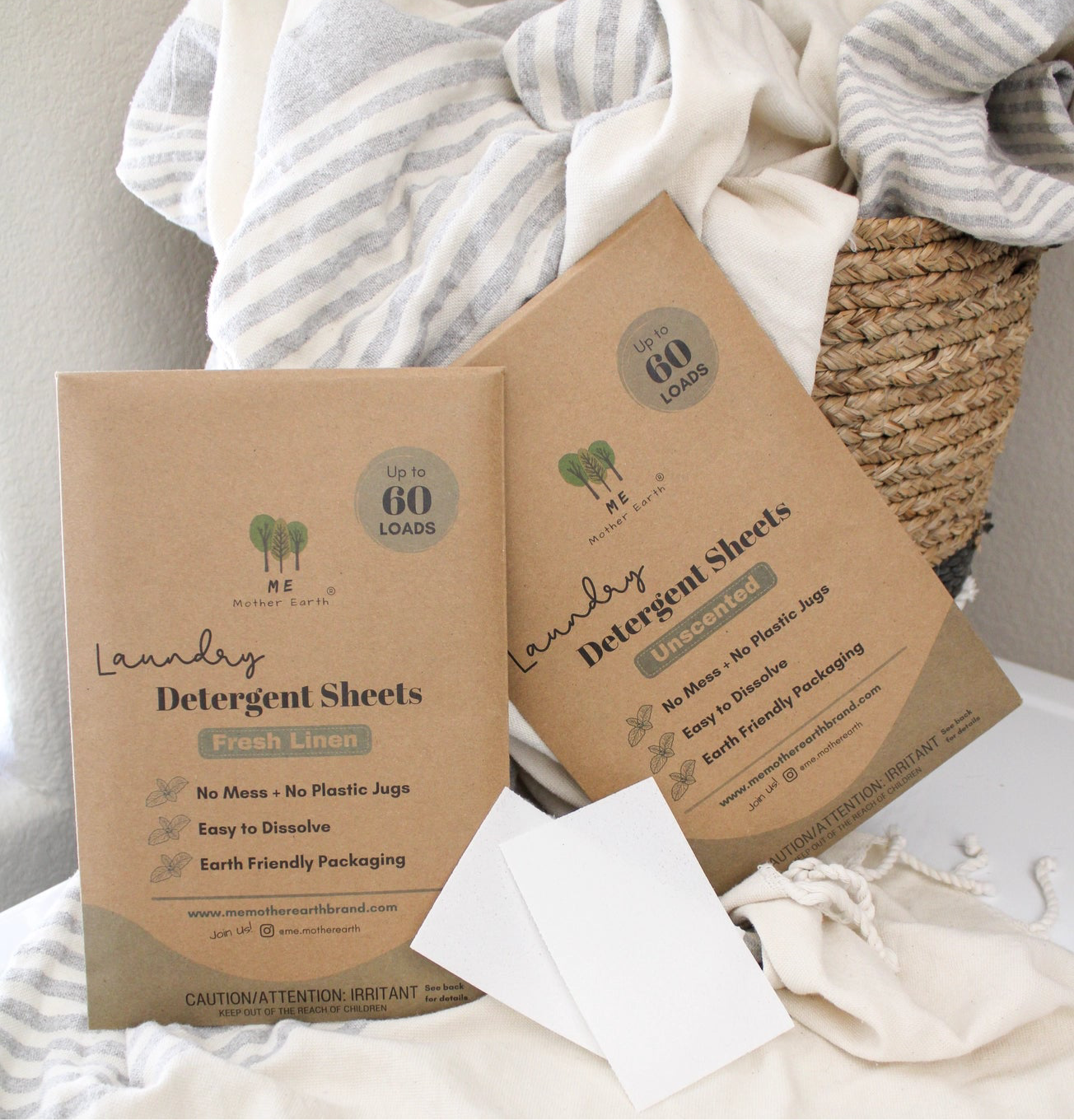 Fresh linen and unscented laundry sheets in brown paper packaging with one sheet ripped in half. 