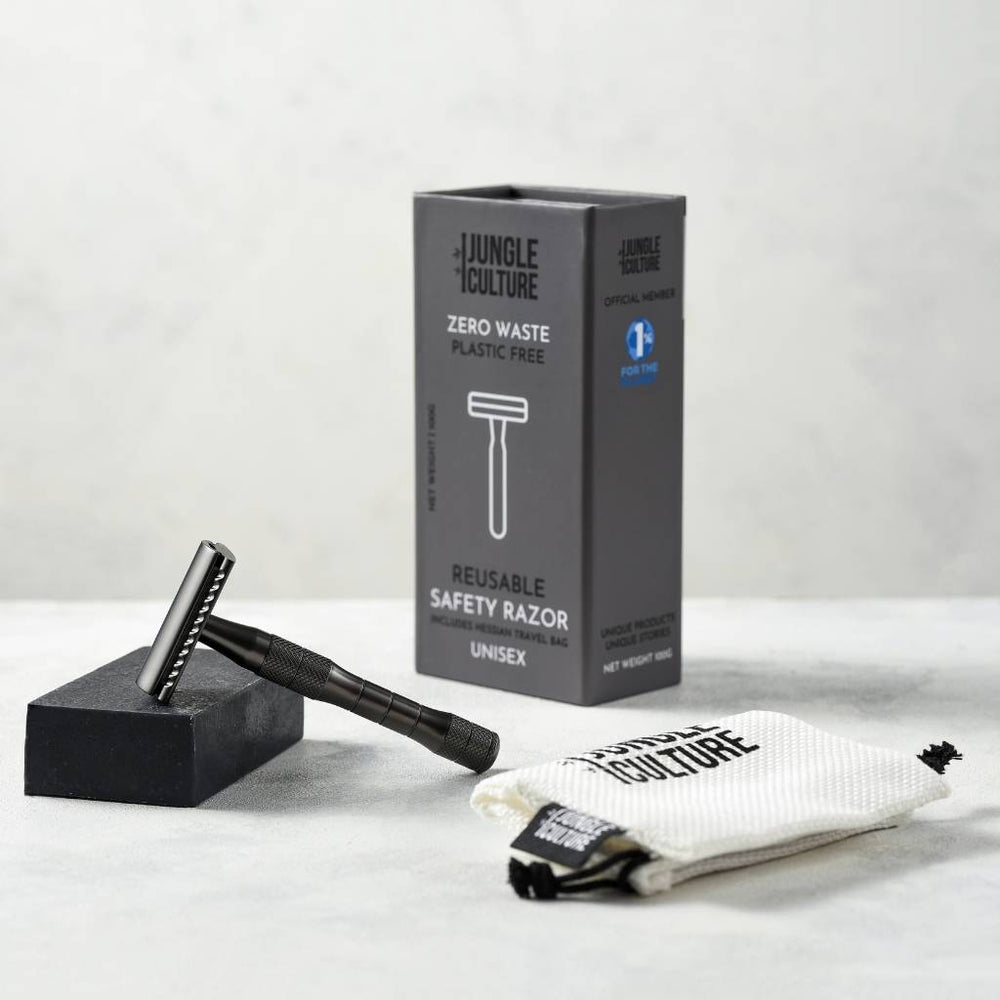 Black safety razor and the packaging it comes with. 