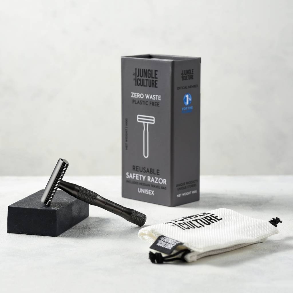 Black safety razor and the packaging it comes with. 