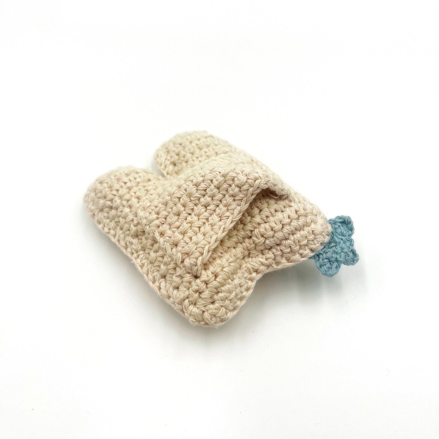 Hand crocheted plush tooth back side with pocket for tooth fairy.